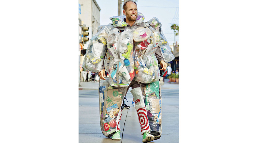 Eco activist spent 30 days wearing his trash – and by the end of the month it weighed 72 lbs