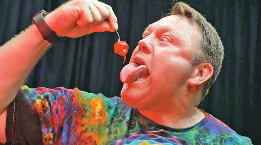 California man sets Guinness World Record for eating 10 Carolina reaper chilies in 33.15 seconds