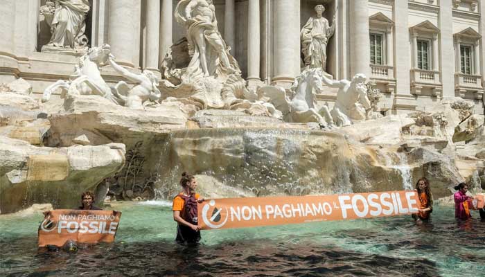 Climate activists attack Rome’s Trevi Fountain, pour vegetable charcoal in water